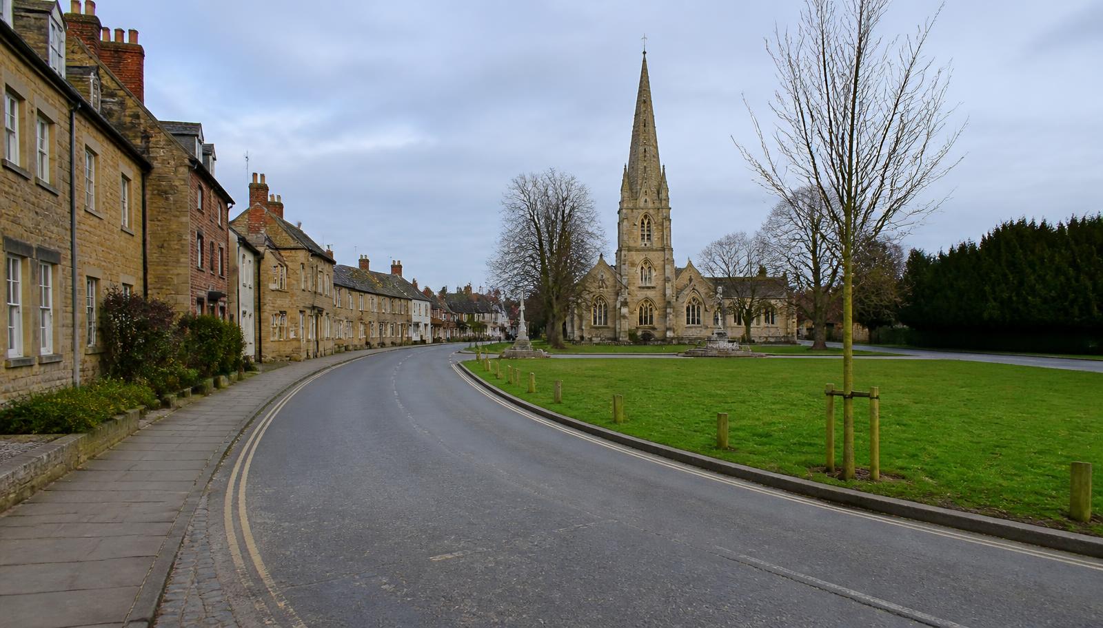 Village high street and church spire in Kidlington, Oxfordshire